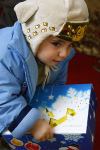 A girl receives a Christmas present from Russian Ministries' national partners