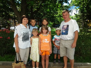 Lera (in orange) and her family