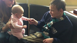 Arturos (17) plays with Noelle, the daughter of Micala Siler (Doorways to Hope)
